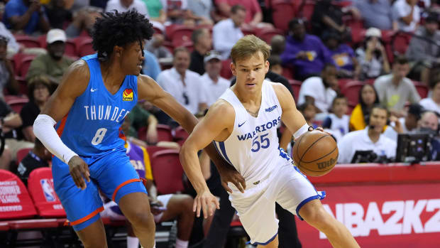 Jul 15, 2022; Las Vegas, NV, USA; Golden State Warriors guard Mac McClung (55) dribbles against Oklahoma City Thunder guard Jalen Williams (8) during an NBA Summer League game at Thomas & Mack Center. Mandatory Credit: Stephen R. Sylvanie-USA TODAY Sports
